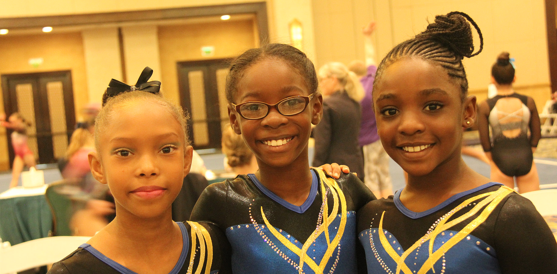 Young gymnasts together at a meet in The Bahamas